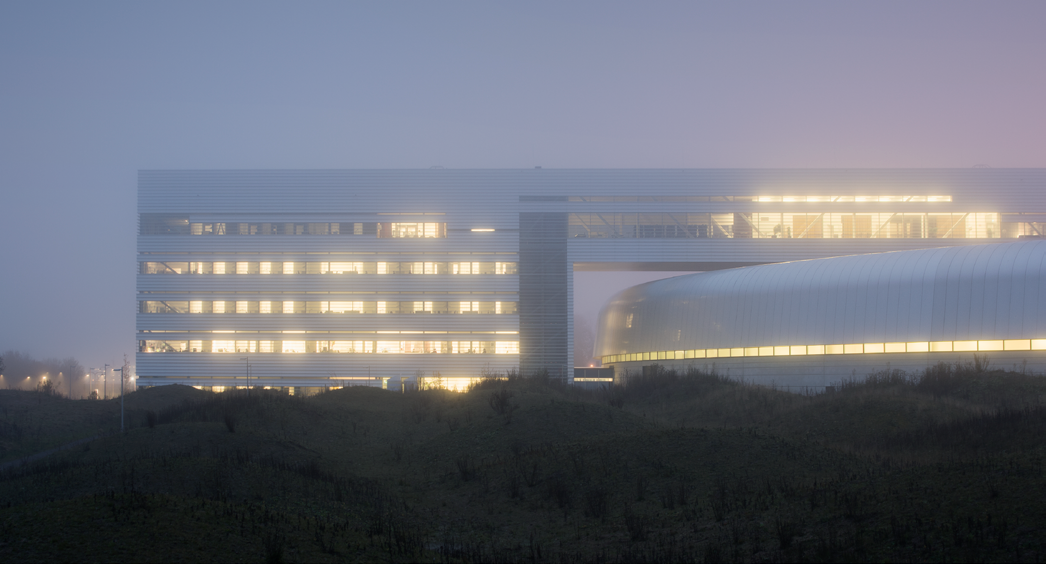 Modern datacenter building representing AI infrastructure